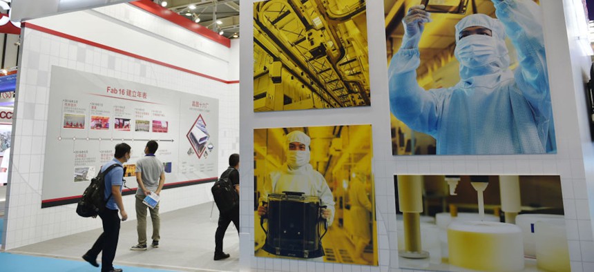 : People visit Taiwan Semiconductor Manufacturing Company (TSMC) booth during 2020 World Semiconductor Conference at the Nanjing International Expo Center on August 27, 2020 in Nanjing, Jiangsu Province of China